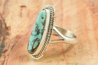 Genuine Royston Turquoise Stone set in Sterling Silver Ring. The Royston Turquoise Mine is located in Nye County, Nevada. Created by Navajo Artist Larson Lee. Signed by the artist.